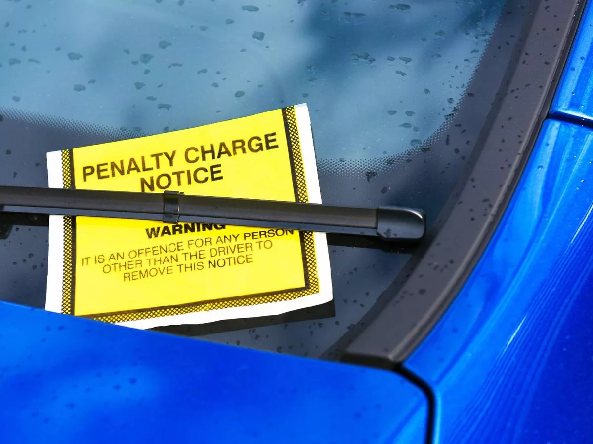 0_Parking ticket on blue car